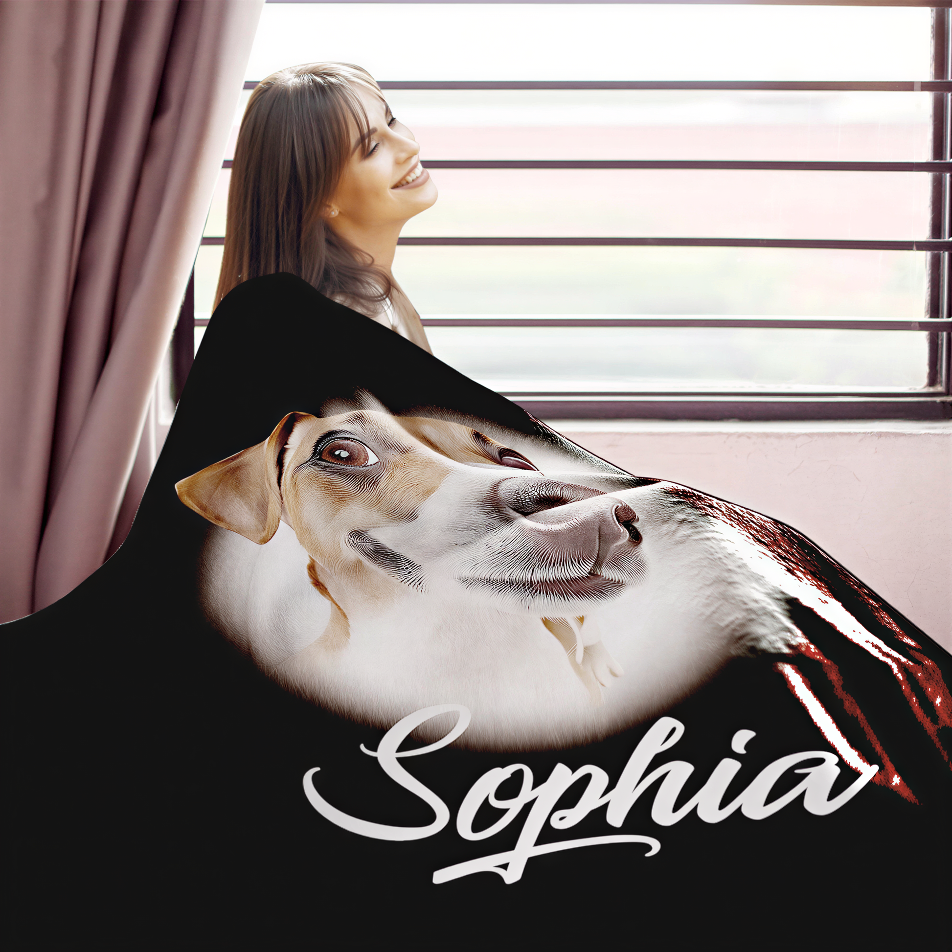 A woman is standing near a window, smiling and looking out. The image features a black blanket with a dog image and the name "Sophia" written on it.