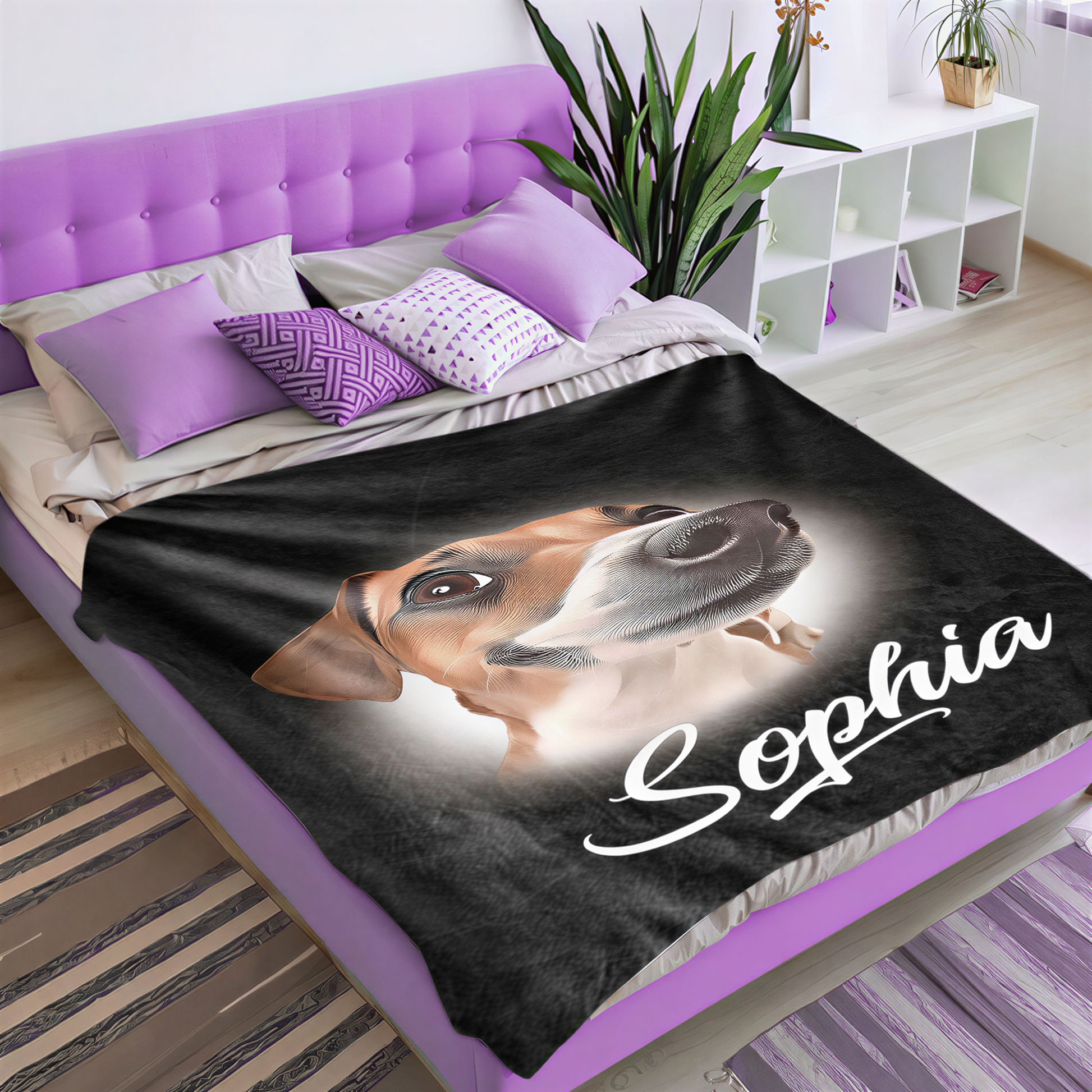 a bedroom with a purple bed frame and a black blanket with a dog's face printed on it. The blanket has the name "Sophia" written on it in white cursive letters.