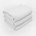 A stack of three white towels.