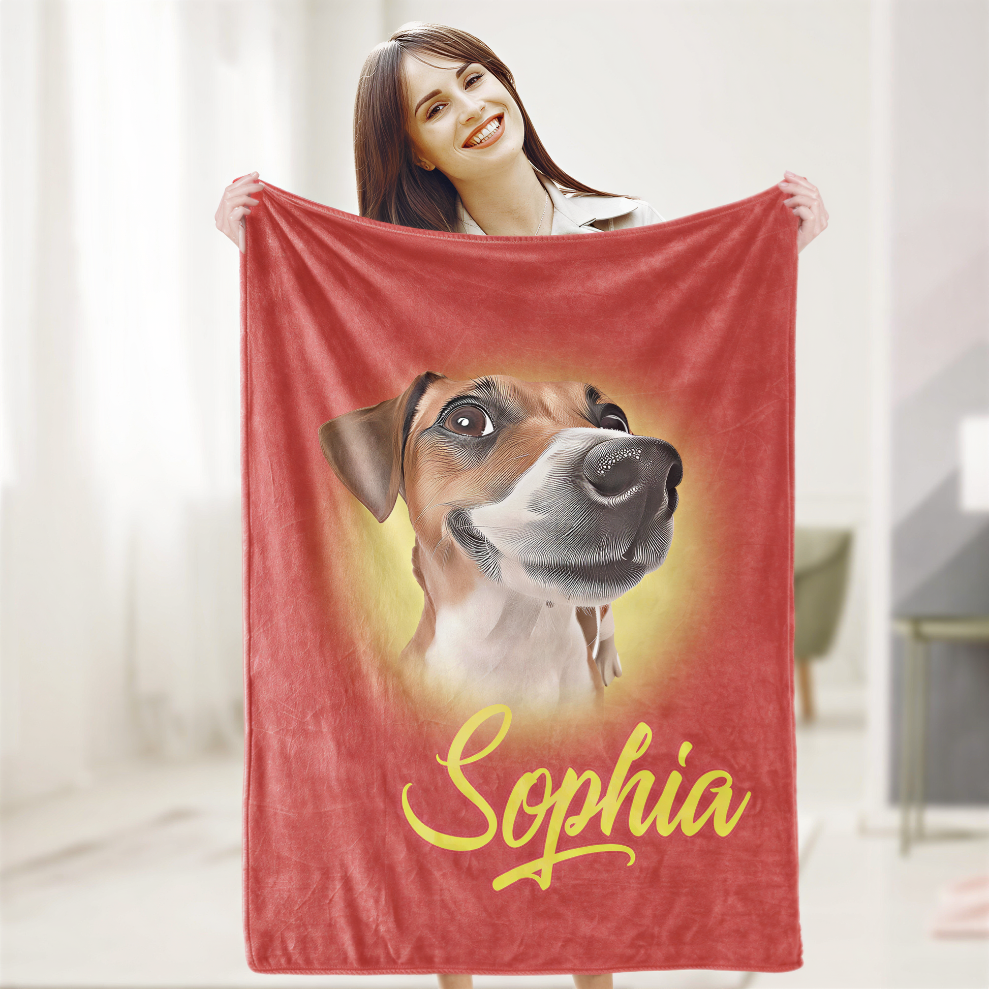 A woman is holding up a red blanket with a picture of a dog on it, and the name "Sophia" is written below the image.